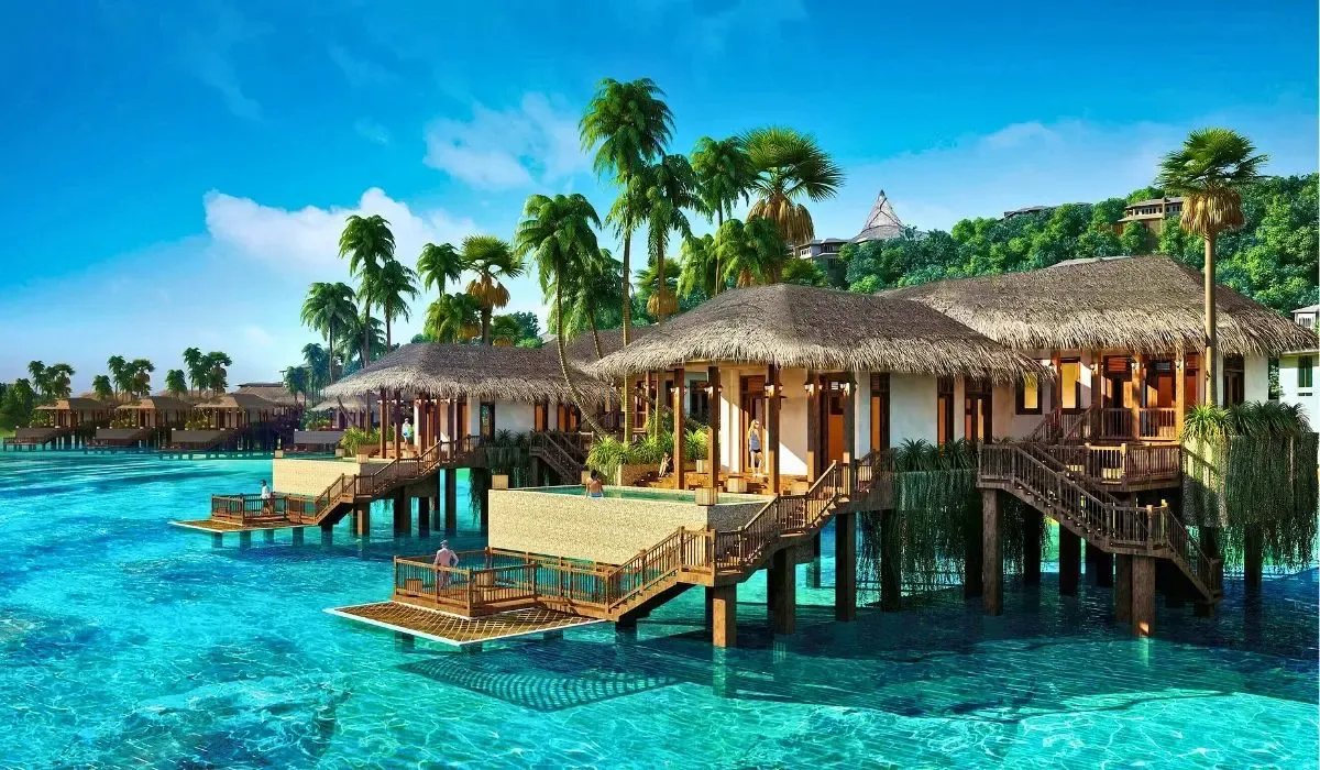 Luxury overwater villas in a tropical paradise with clear blue waters and palm trees, ideal for showcasing overseas property purchases.