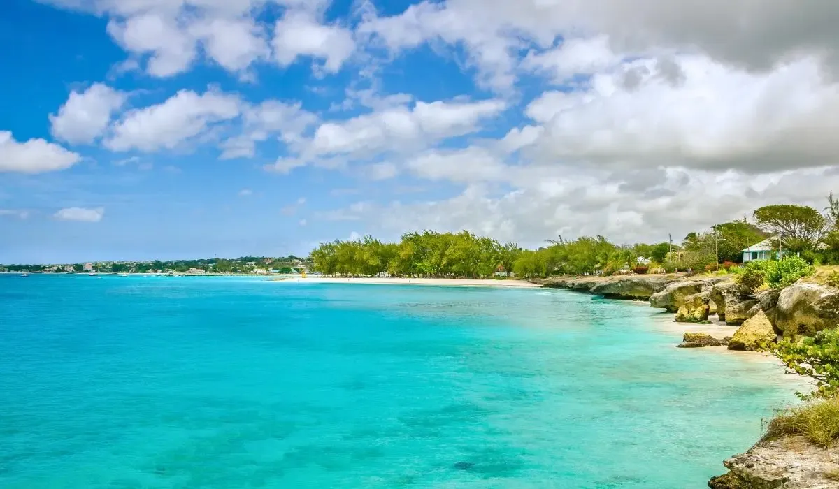 A vibrant street scene in Bridgetown, Barbados, highlighting colonial architecture, colorful buildings, and bustling local markets.