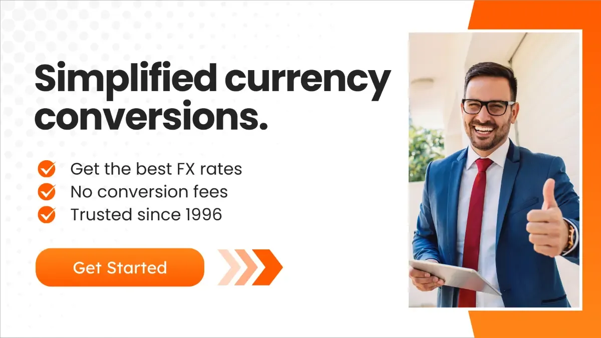 Promotional banner reading “Simplified currency conversions” with bullet points highlighting best FX rates, no conversion fees, and trust since 1996, alongside a smiling businessman giving a thumbs-up and a “Get Started” button.