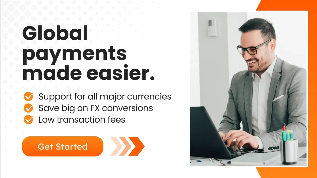 A businessman on a laptop with text about global payments, currency support, and low fees.