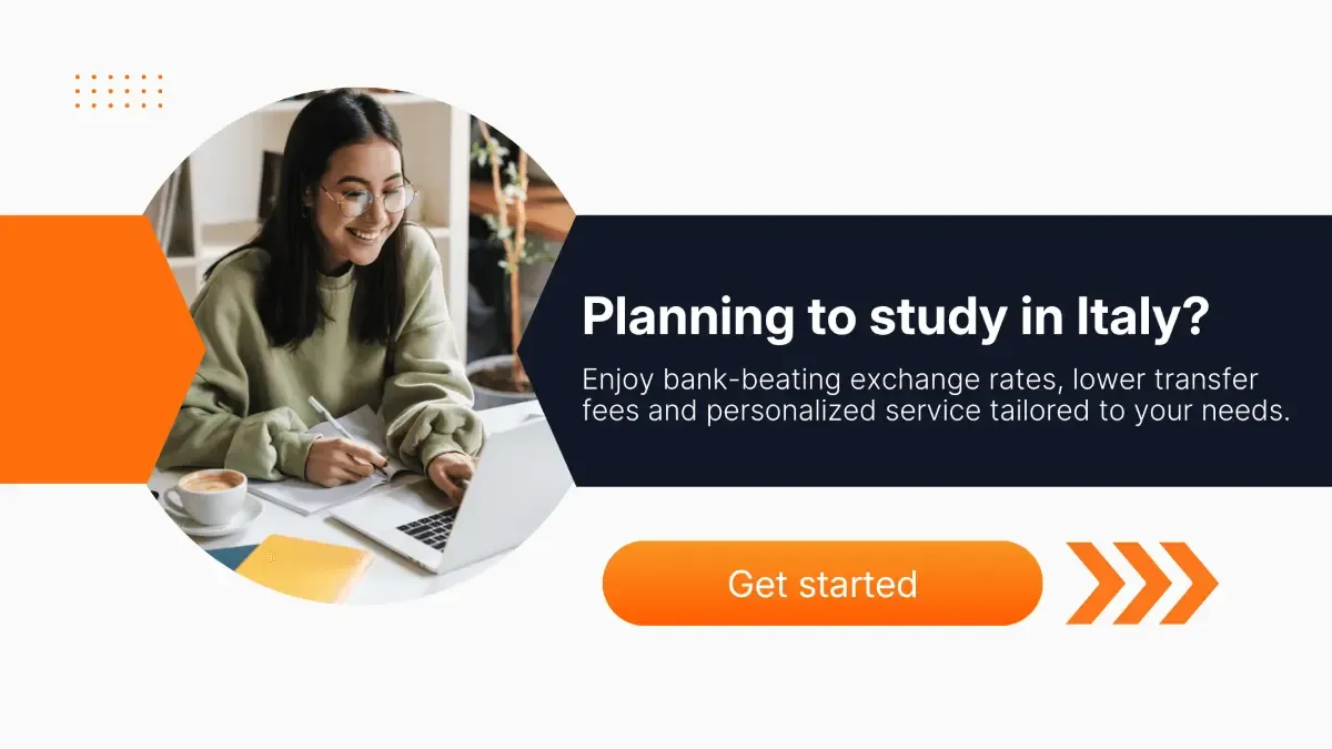 Smiling student with glasses studying on a laptop in a cozy space with a coffee, promoting affordable CAD to EUR transfers for Canadian students planning to study in Italy.