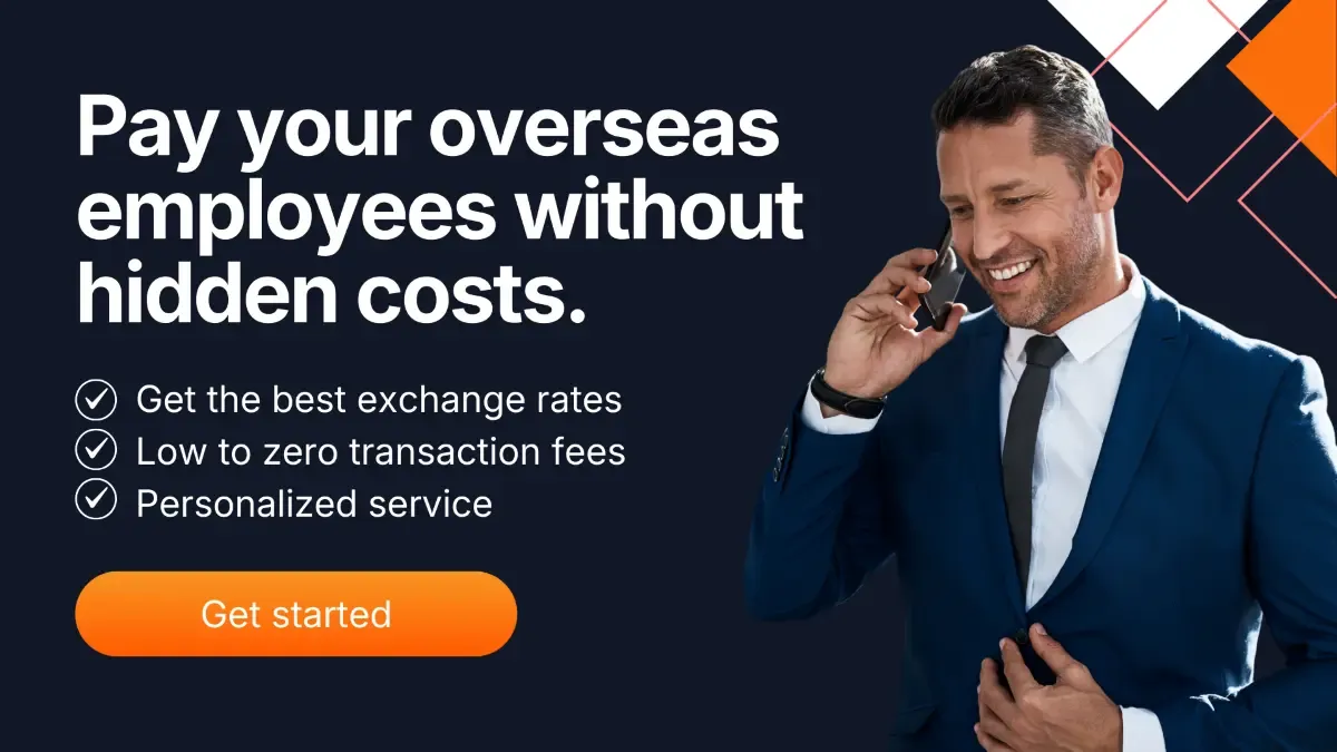 Business professional making a call about paying overseas employees with low-cost international payments through MTFX.