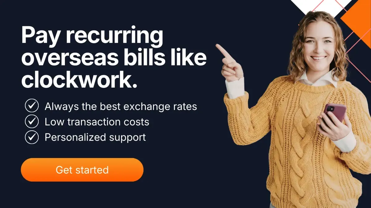 Woman holding a smartphone and pointing to overseas bill payment options with competitive exchange rates and low transaction costs.