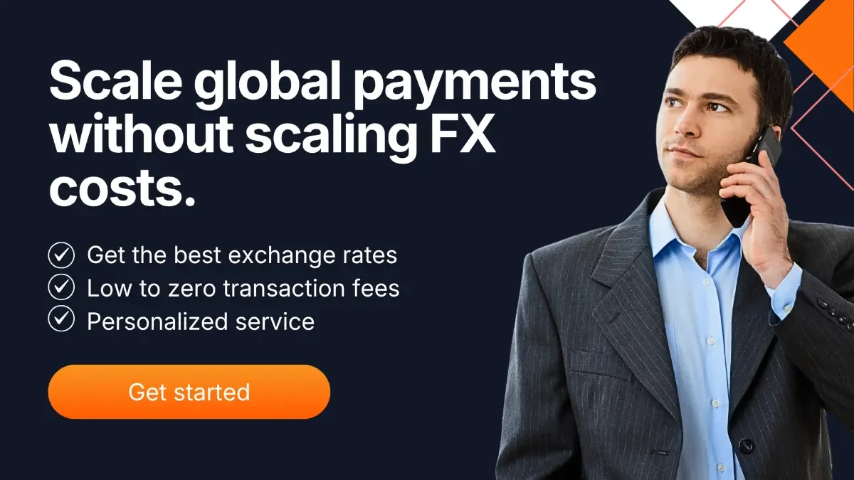 Business professional on a phone beside text highlighting scalable global payments, low FX costs, best exchange rates, and personalized service.