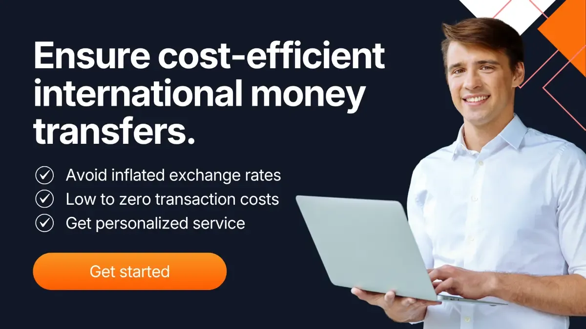 Professional holding a laptop with message about cost efficient international money transfers, highlighting lower exchange rates and personalized FX services