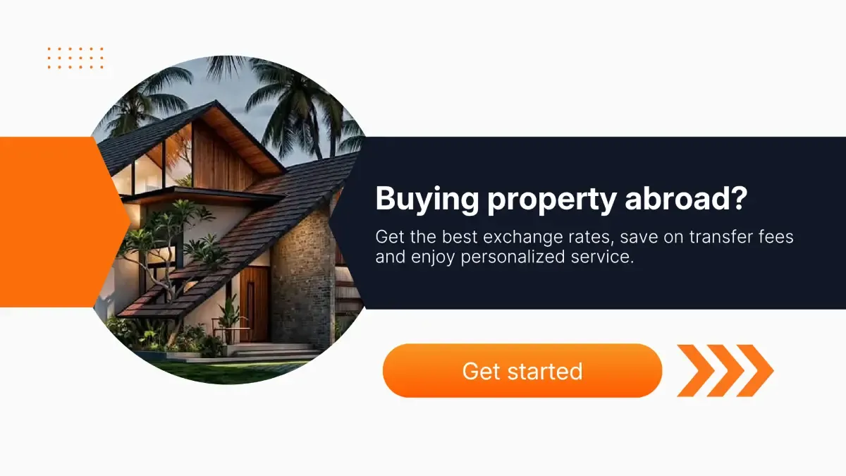 Modern house surrounded by palm trees beside promotional text about buying property abroad, highlighting competitive exchange rates, lower transfer fees, personalized service, and a Get started button.
