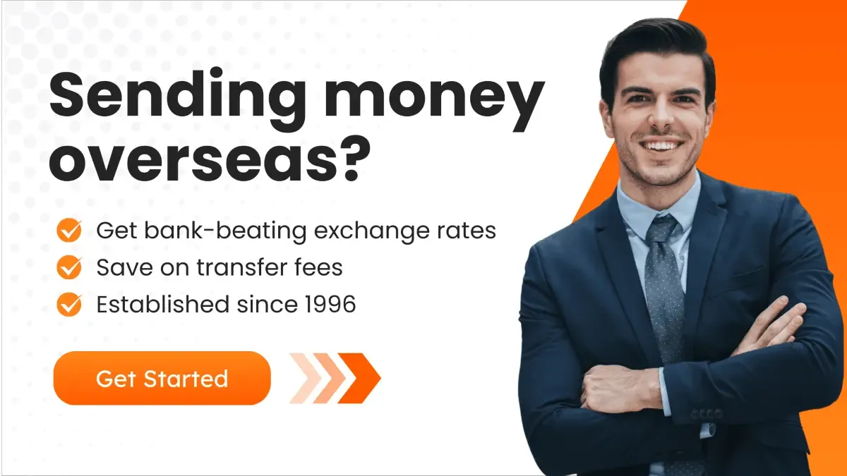 Professional man in a suit smiling, with text highlighting benefits of sending money overseas, including better exchange rates, low transfer fees, and a trusted service established since 1996.