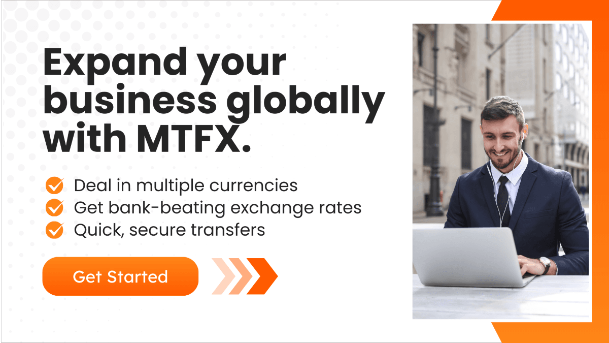 A promotional banner with a businessman working on his laptop with the text promoting, MTFX’s benefits like multi-currency transactions, competitive exchange rates, and secure transfers