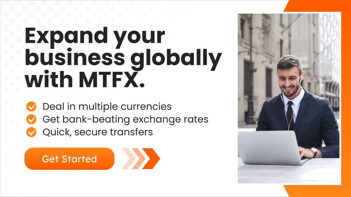 A promotional banner with a businessman working on his laptop with the text promoting, MTFX’s benefits like multi-currency transactions, competitive exchange rates, and secure transfers