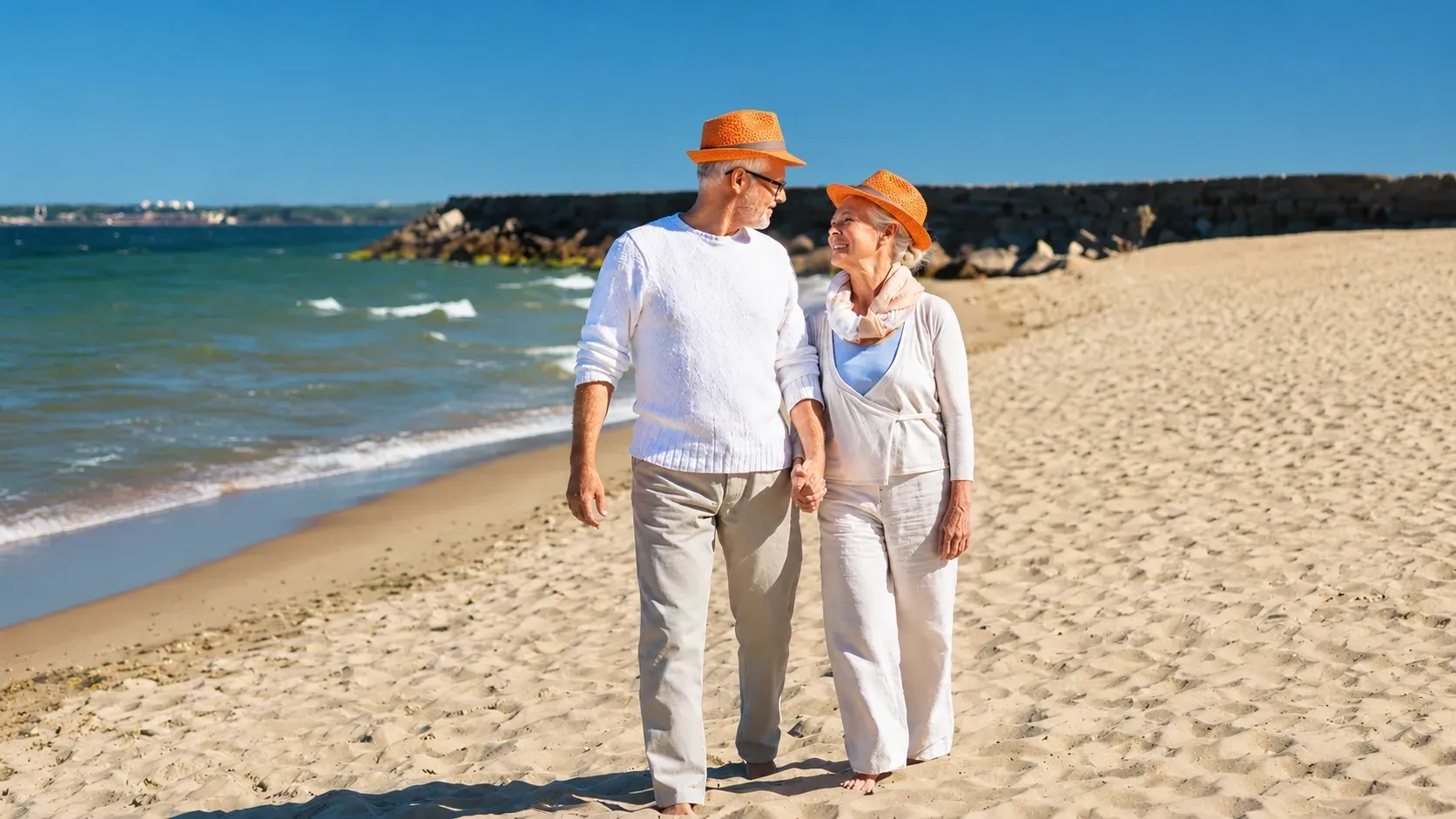 Canadian retirees enjoying a beach walk abroad, illustrating pension planning for Canadians retiring overseas.