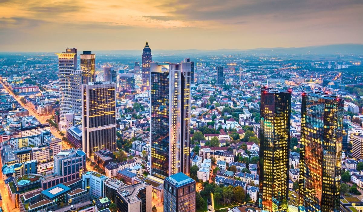 Frankfurt cityscape at twilight with modern office towers and city lights