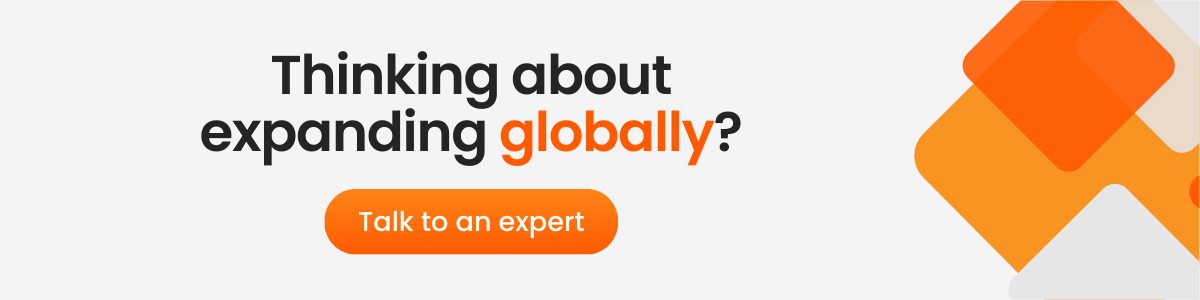 A digital ad with bold black and orange text that reads 'Thinking about expanding globally?' followed by an orange button labeled 'Talk to an expert'. The background has abstract orange and white geometric shapes.