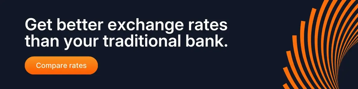 Banner with bold text encouraging users to get better exchange rates than traditional banks, featuring an orange wave graphic and a Compare Rates button.