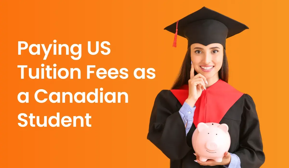Female graduate smiling while holding a pink piggy bank, dressed in a black graduation gown and red stole. The text reads 'Paying US Tuition Fees as a Canadian Student' against an orange background.