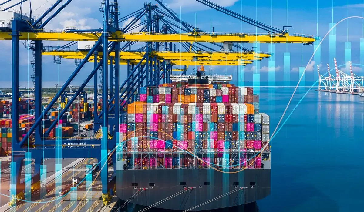 Container ship at the shipping dock with cargo containers onboard.