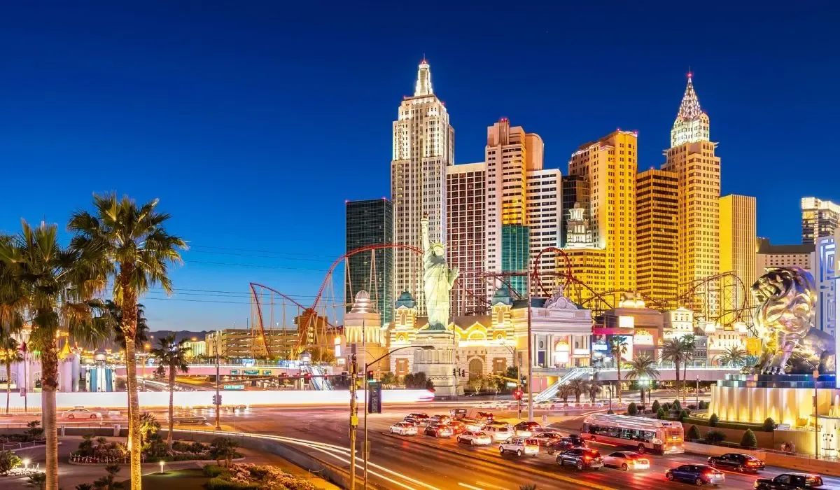 A panoramic view of the Las Vegas Strip at night, showcasing illuminated hotels, casinos, and the vibrant city skyline.