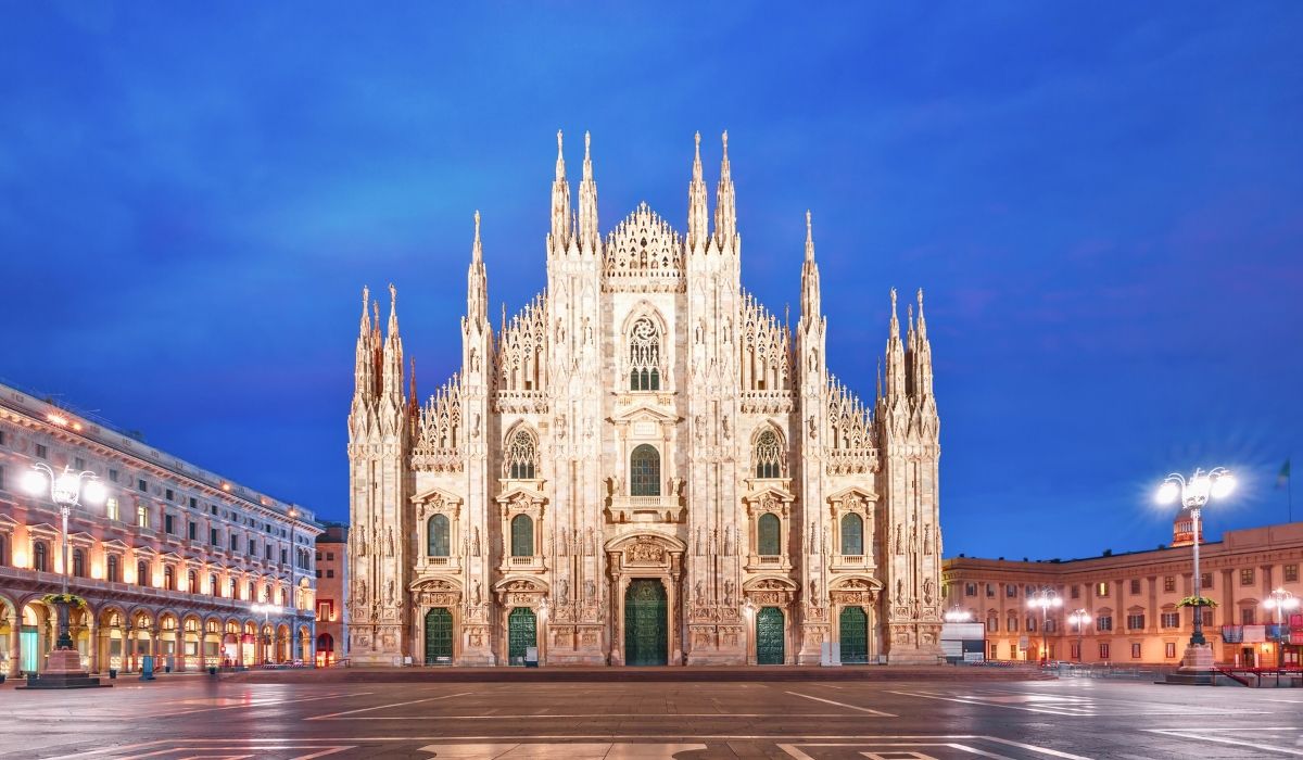 A bustling street scene in Milan, featuring the iconic Milan Cathedral.