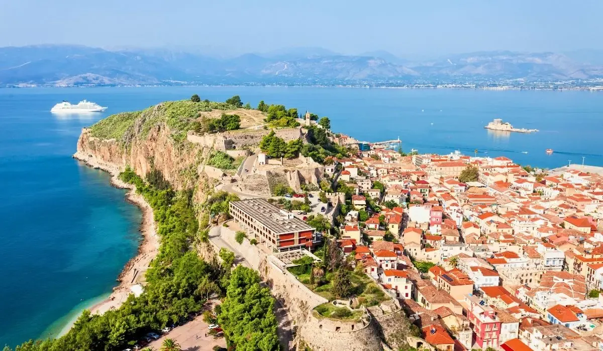 Scenic view of Nafplio’s historic fortress and vibrant coastline, a prime spot for property investment in Greece where Canadians can save on currency transfers with favorable CAD to EUR rates.