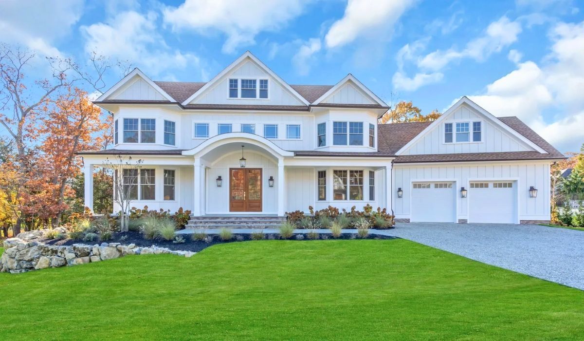 Modern family house in New Jersey with a wide driveway and bright facade.