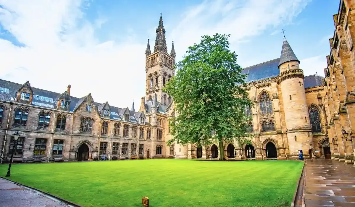 Historic courtyard of the University of Oxford, featuring Gothic architecture and central tower.