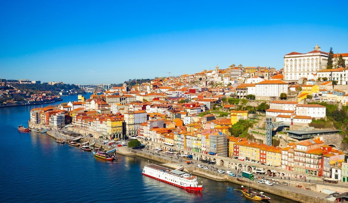 Picturesque waterfront city in Portugal, highlighting a popular European location for Canadians purchasing property abroad.