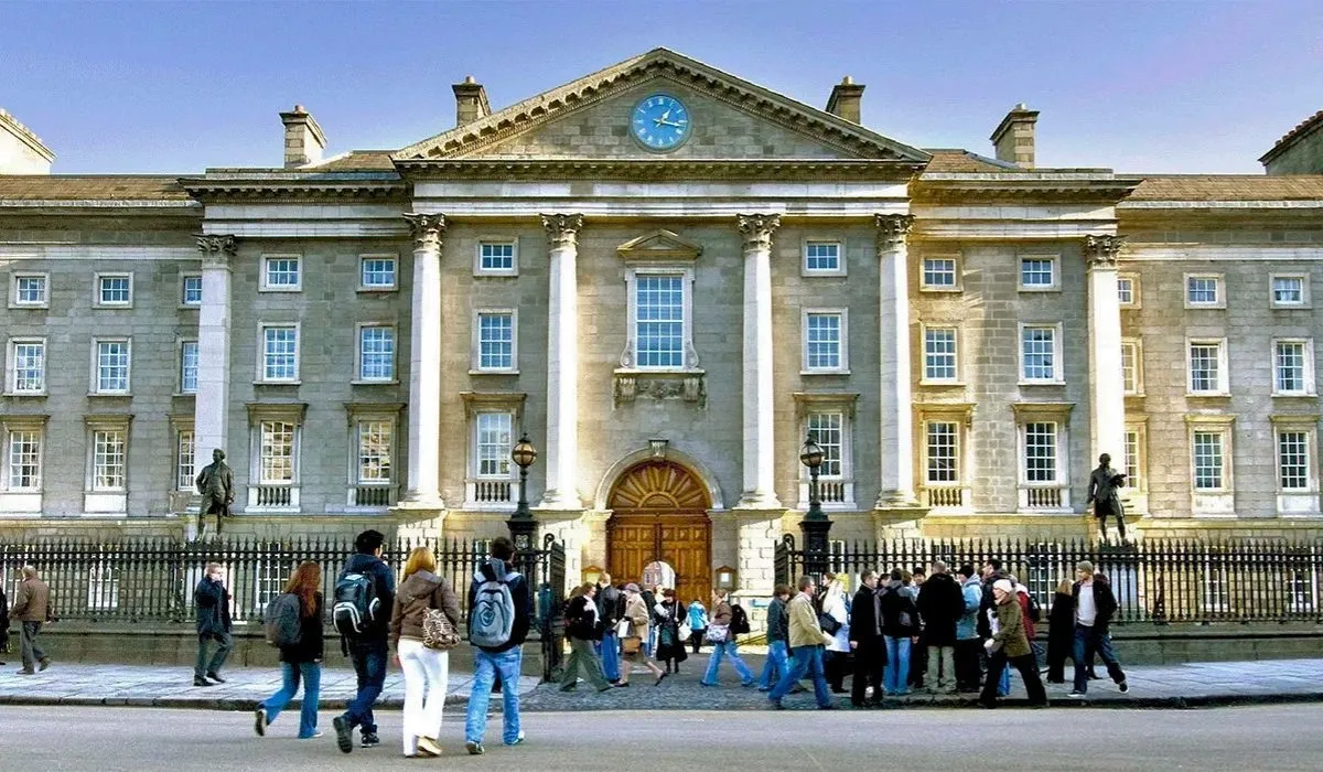 Students pass by the neoclassical entrance of Trinity College Dublin. MTFX lets Canadian students pay tuition in euros directly from Canada while saving on every transfer.
