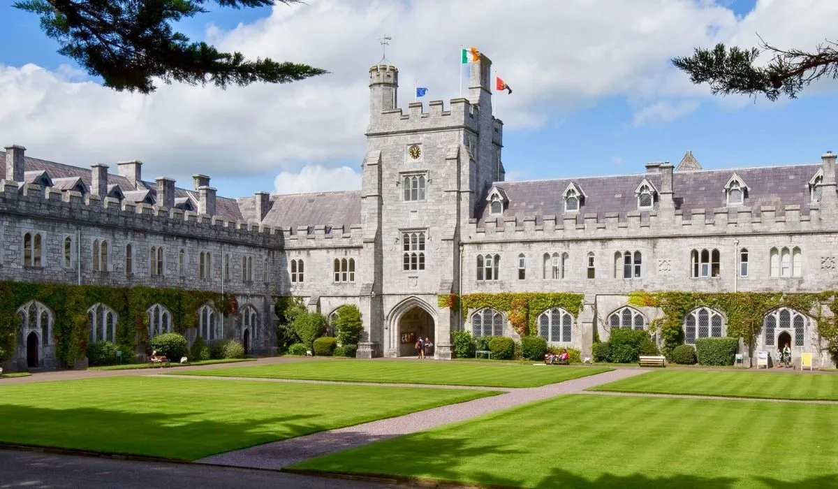Students walking near the historic stone quadrangle at University College Cork. Canadian students can send EUR tuition directly from Canada and avoid high bank charges with MTFX.