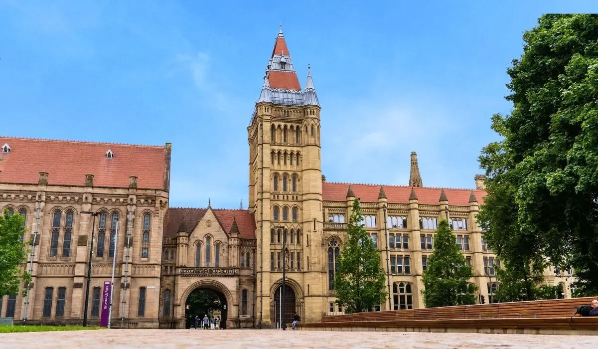 A cityscape including the University of Manchester’s red-brick buildings and modern towers, reflecting its blend of history and innovation.