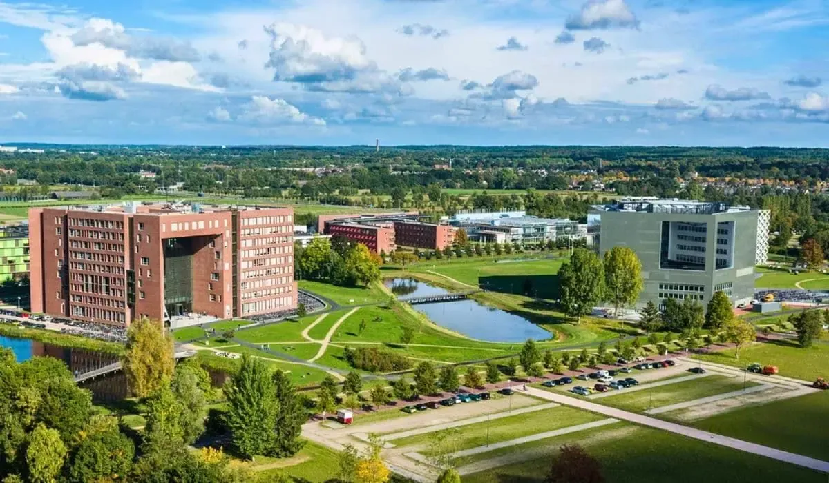 Aerial view of Wageningen University’s green campus with ponds and research facilities. Send tuition in EUR from Canada affordably and on time with MTFX trusted transfer services.