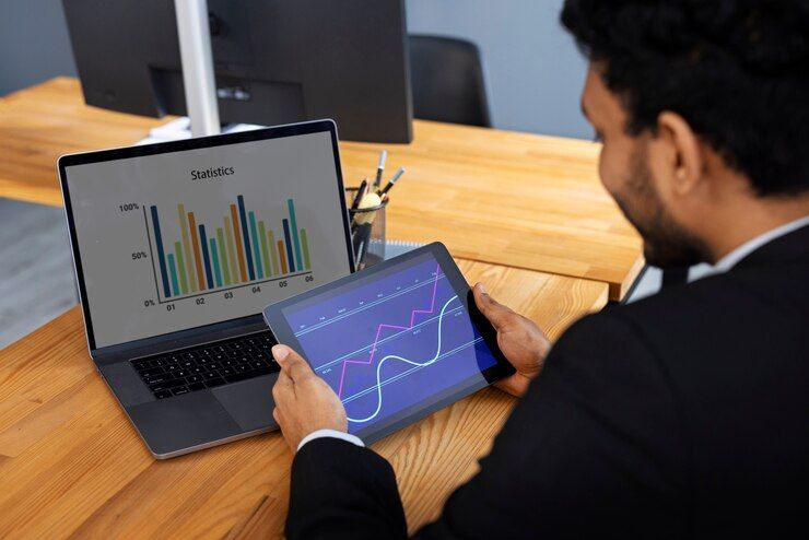 business_person_looking_finance_graphs_23_2150461313_6dc274470e
