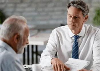 Businessman in conversation during a professional meeting in a modern office