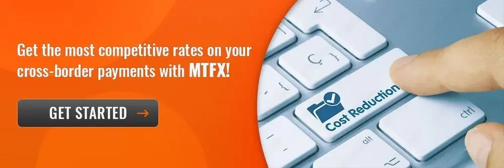 Finger pressing a keyboard key labeled "Cost Reduction" alongside a promotional message about competitive rates for cross-border payments with MTFX.