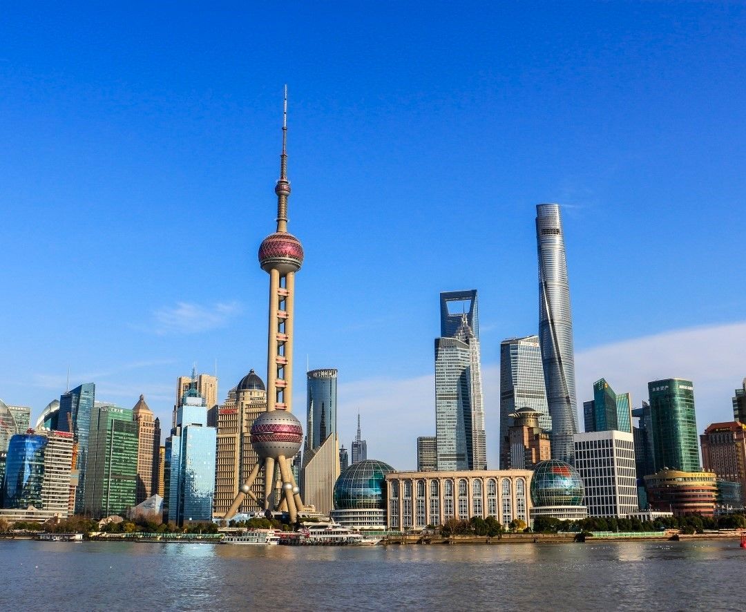  Modern skyline of Shanghai viewed from across the river, representing China's economic landscape and a common destination to send money to China for business or family.