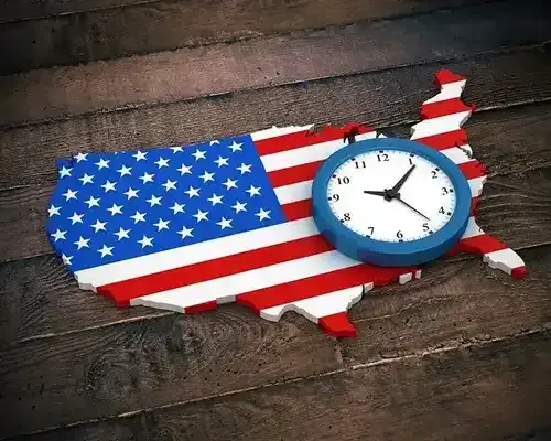 A 3D illustration of the United States map covered in the American flag with a blue-rimmed clock placed over it, symbolizing time it takes for the payment to reach US.